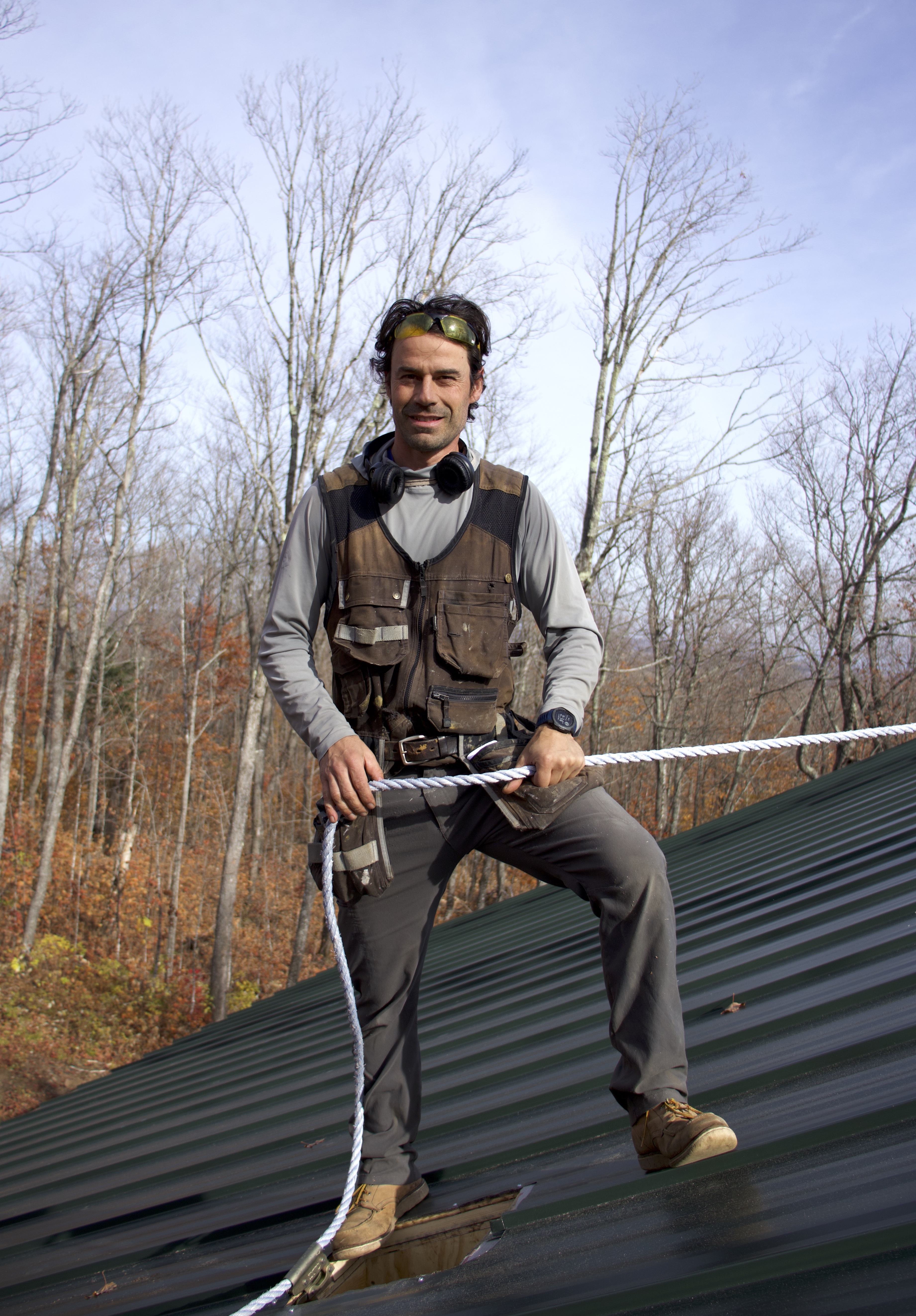 MW Build Team Member on a Roof